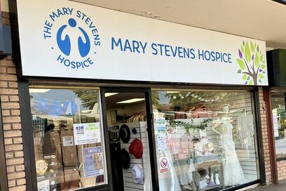 the front of a small charity shop, with 'Mary Stevens Hospice' on the signage