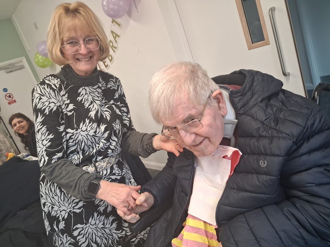 a patient and their carer at the spring high tea event