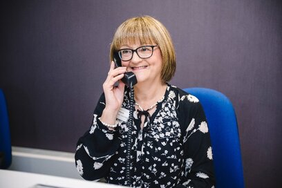 woman on the phone talking to supporter